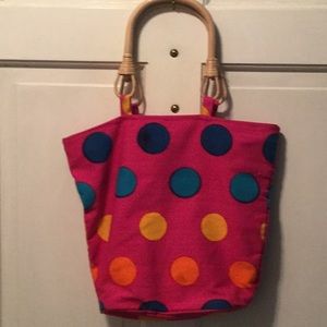 Brightly patterned beach bag with matching shawl.